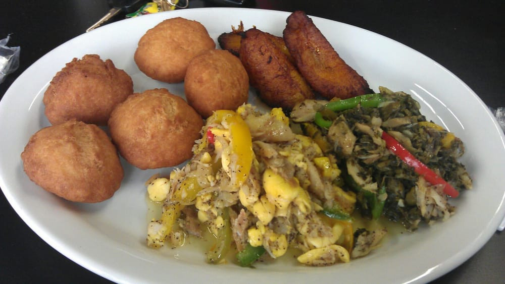 Saltfish And Dumplings
 ackee and salt fish with fried dumplings and callaloo and