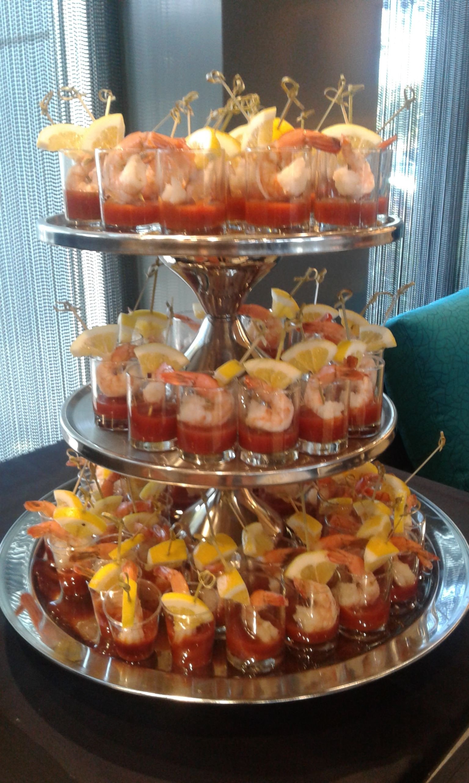 Seafood Party Appetizers
 spinning shrimp cocktail tower constructed with three